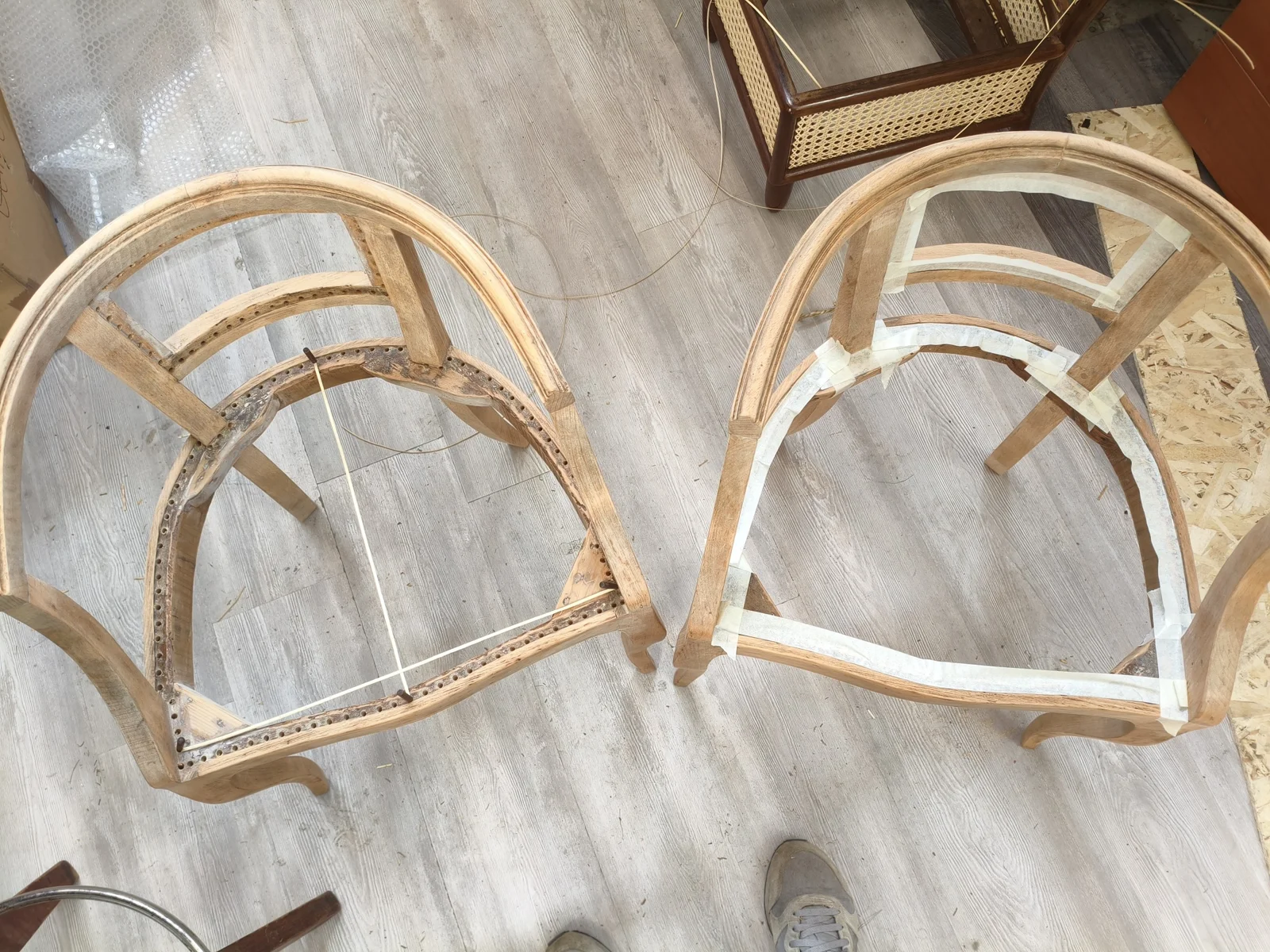 Bare chair frames showing construction before weaving