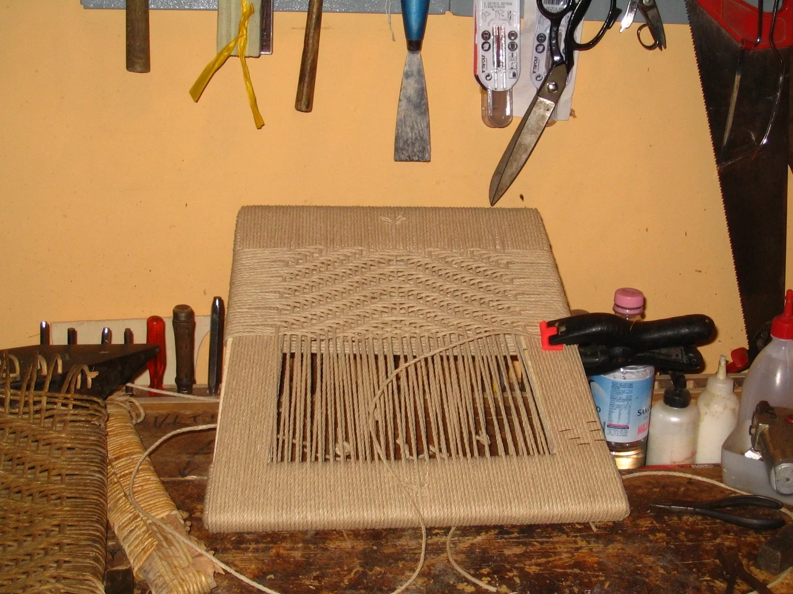 Chair with a corded pattern being made